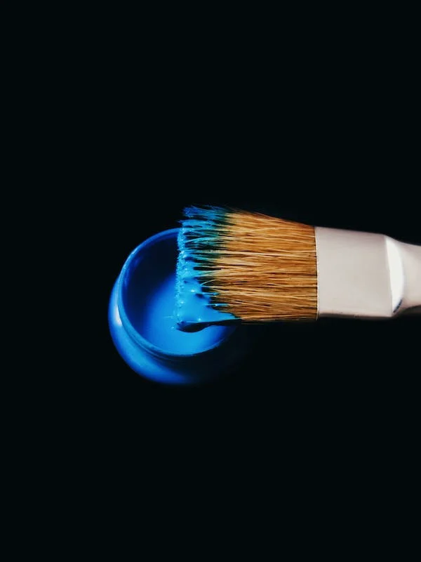 photo of paint on brush (solution to artist block)